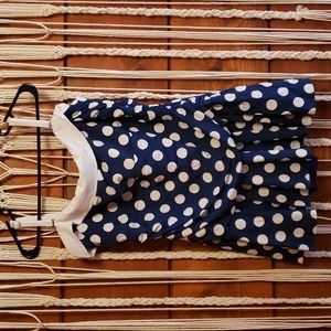 Navy and white one piece skirted swimsuit